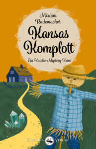 Cover »Kansas Komplott«: Sommerlandschaft, im Vordergrund eine Vogelscheuche, über eine smaragdgrüne Wiese führt ein Sandweg Richtung Horizont zu einem verfallenen Haus